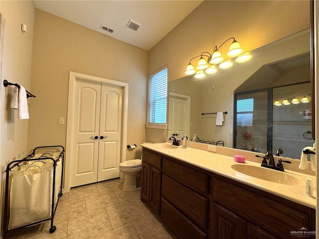 bathroom with walk in shower, tile patterned flooring, lofted ceiling, toilet, and vanity