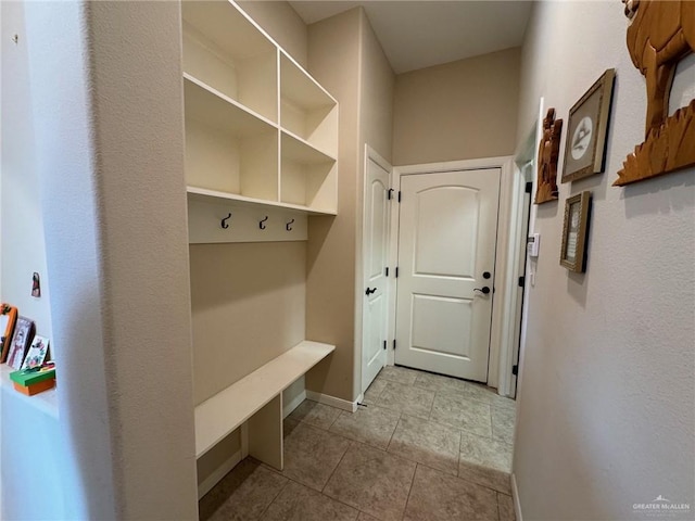 mudroom featuring light tile patterned floors