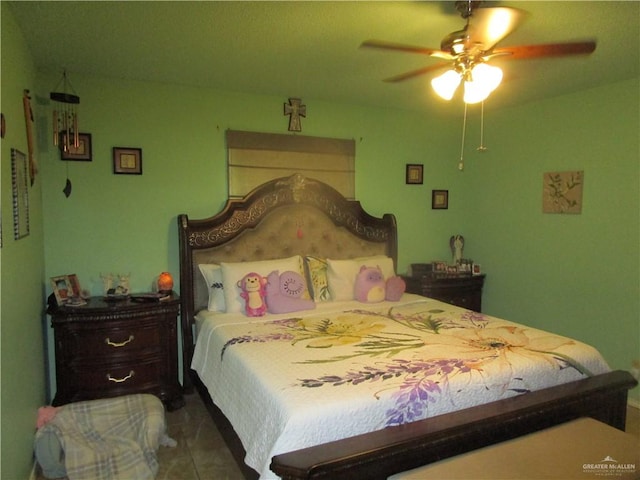 tiled bedroom with ceiling fan