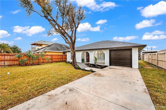 single story home featuring a garage and a front lawn