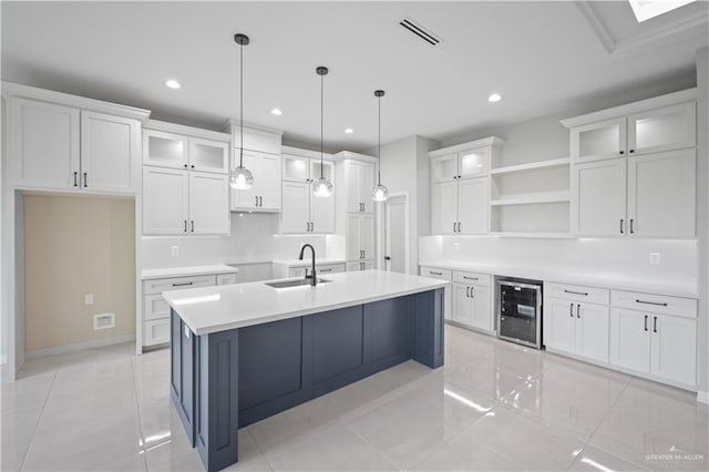 kitchen with beverage cooler, a sink, visible vents, white cabinets, and open shelves