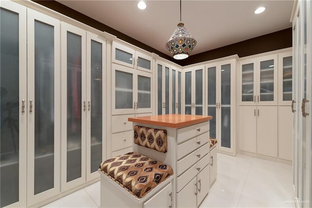 spacious closet with light tile patterned floors