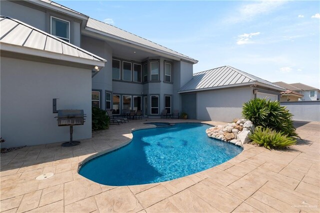 view of pool with a fenced in pool and a patio area