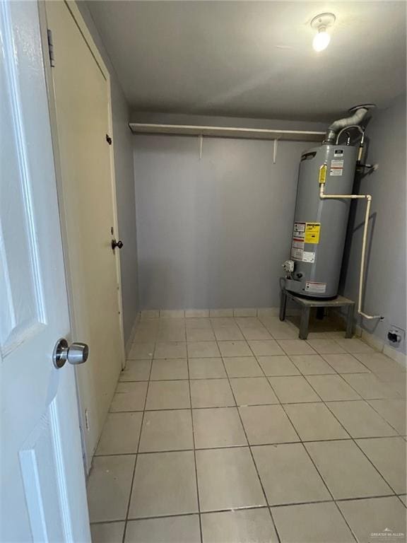 utility room with gas water heater