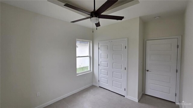 406 Zapata St, San Juan, TX 78589 - unfurnished bedroom featuring baseboards and ceiling fan