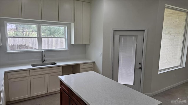 406 Zapata St, San Juan, TX 78589 - kitchen featuring a sink, light countertops, baseboards, and tile patterned flooring