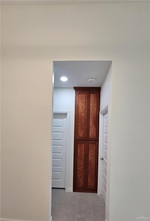 406 Zapata St, San Juan, TX 78589 - corridor with light tile patterned floors, baseboards, and recessed lighting