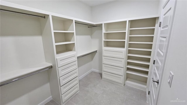 406 Zapata St, San Juan, TX 78589 - spacious closet with light tile patterned floors