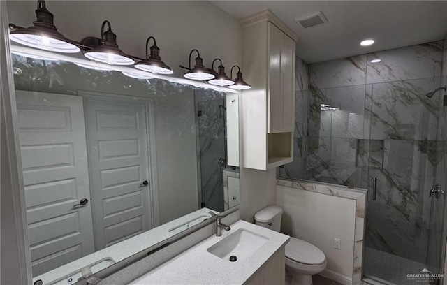 406 Zapata St, San Juan, TX 78589 - full bath with a marble finish shower, toilet, vanity, and recessed lighting