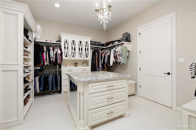 spacious closet with a notable chandelier