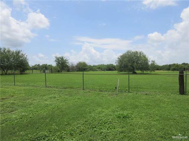 view of yard with a rural view