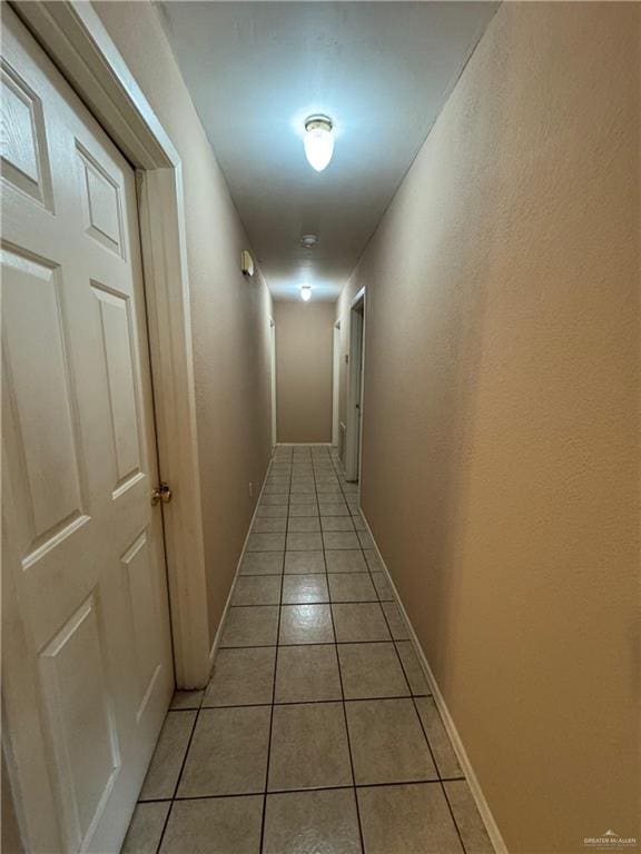411 N Fir St, Pharr, TX 78577 - hallway featuring light tile patterned floors and baseboards