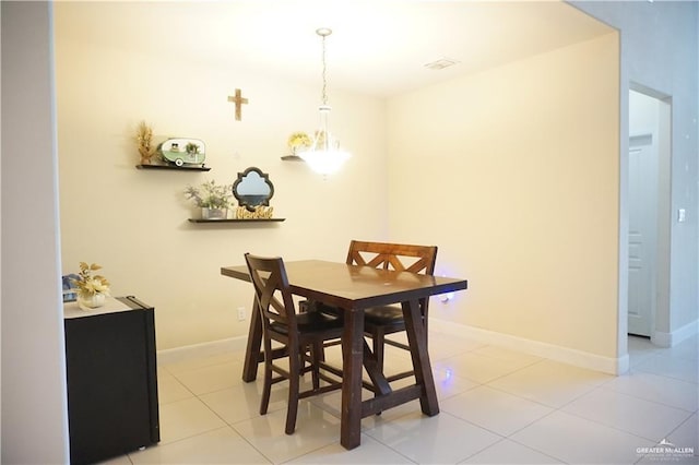 dining area with light tile patterned flooring