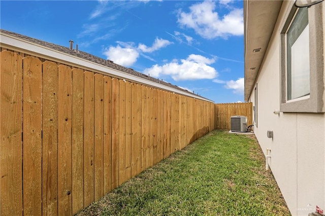 view of yard with central AC