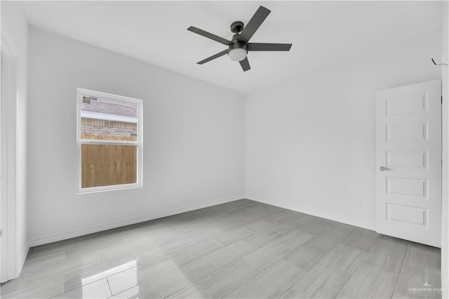 empty room featuring ceiling fan and light hardwood / wood-style floors