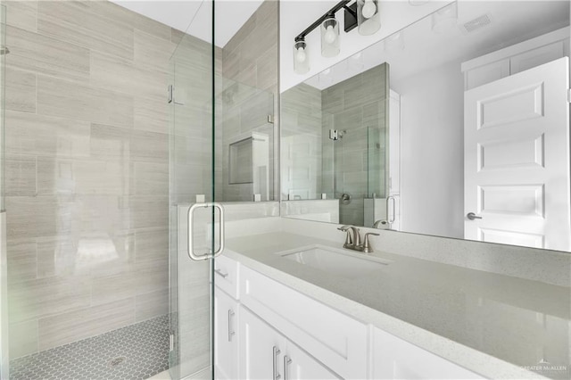 bathroom with vanity and an enclosed shower