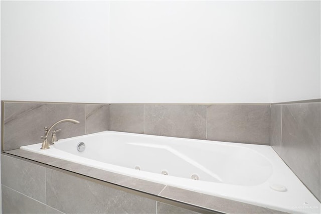 bathroom with tiled bath