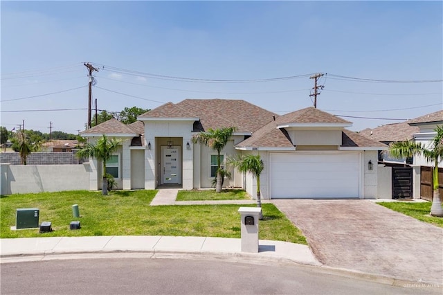 view of front of home with a garage and a front yard