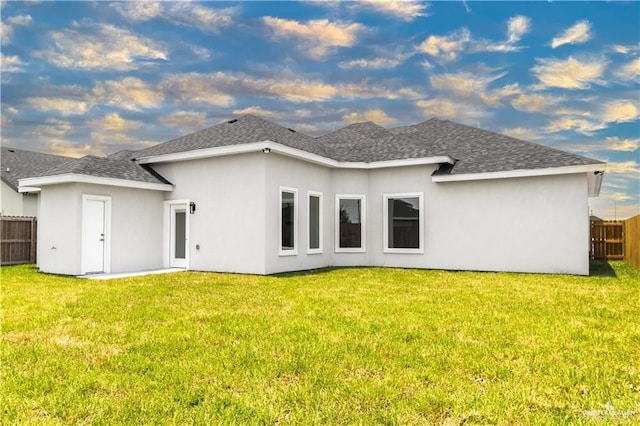 1201 Moses Dr, San Juan, TX 78589 - back of house featuring roof with shingles and stucco siding