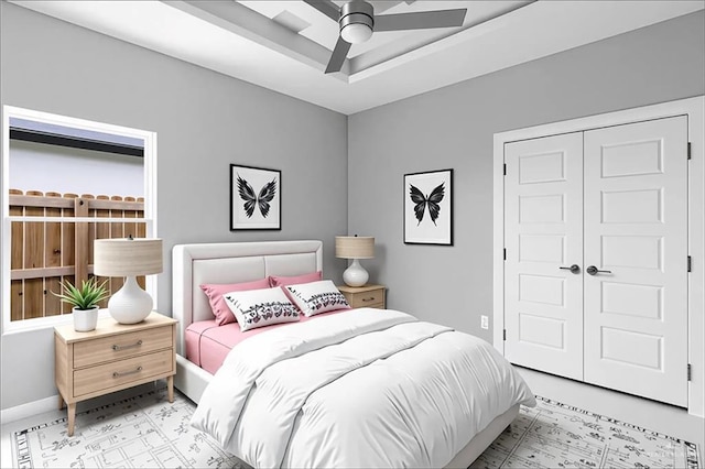 1201 Moses Dr, San Juan, TX 78589 - bedroom featuring a closet, ceiling fan, a tray ceiling, and baseboards