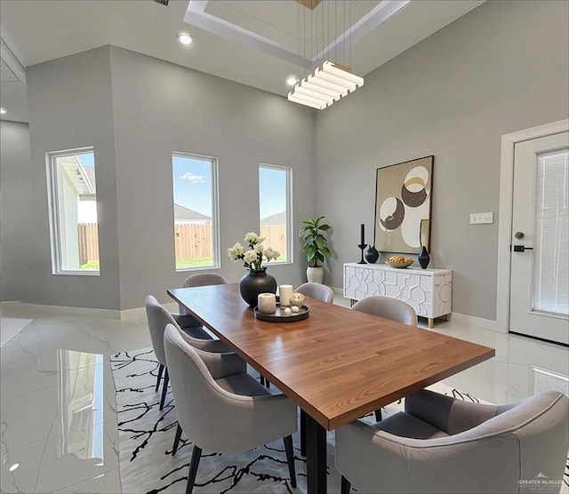 1201 Moses Dr, San Juan, TX 78589 - dining area with a high ceiling, baseboards, recessed lighting, and marble finish floors