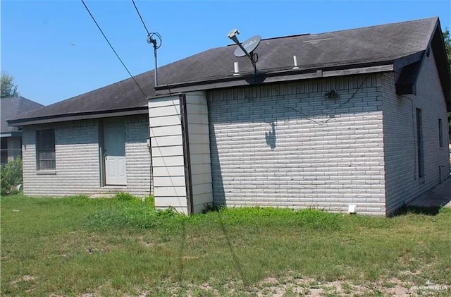 view of property exterior with a lawn