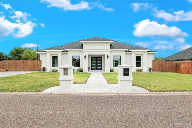 view of front facade featuring french doors and a front yard