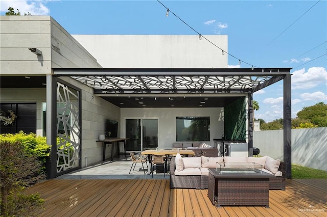 wooden deck featuring an outdoor living space