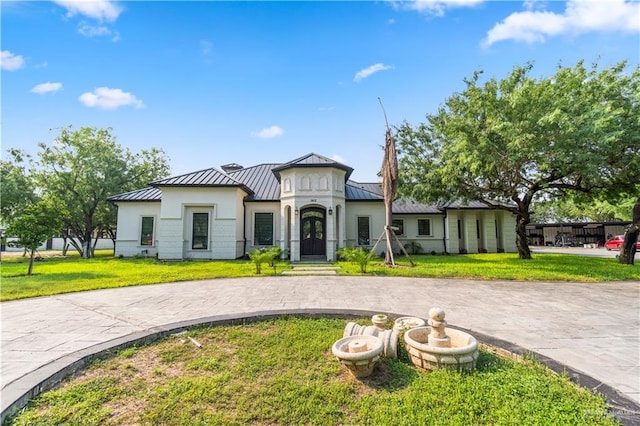 1412 E Mile 2nd Rd, Mission, TX 78574 - view of front facade featuring a standing seam roof, metal roof, and curved driveway