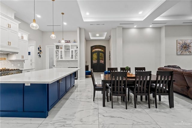 1412 E Mile 2nd Rd, Mission, TX 78574 - dining space with light marble finish floors, french doors, recessed lighting, and a tray ceiling