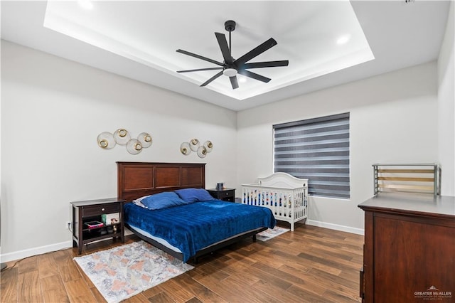 1412 E Mile 2nd Rd, Mission, TX 78574 - bedroom featuring a raised ceiling, baseboards, wood finished floors, a ceiling fan, and recessed lighting