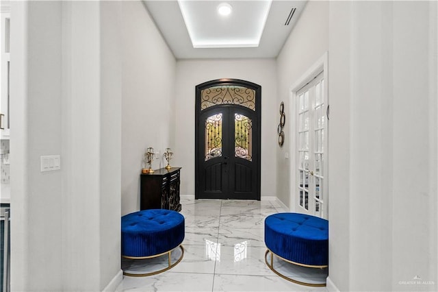 1412 E Mile 2nd Rd, Mission, TX 78574 - entrance foyer featuring marble tiled flooring, french doors, a raised ceiling, and baseboards