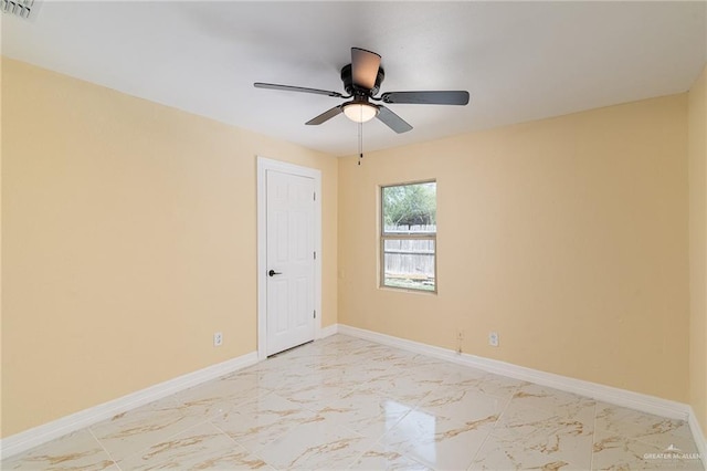 803 W Longoria St, Pharr, TX 78577 - empty room with light marble finish flooring, baseboards, and a ceiling fan