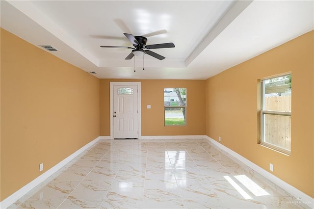 803 W Longoria St, Pharr, TX 78577 - entryway featuring a raised ceiling, plenty of natural light, ceiling fan, and baseboards
