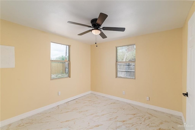 803 W Longoria St, Pharr, TX 78577 - unfurnished room featuring light marble finish floors, baseboards, and ceiling fan