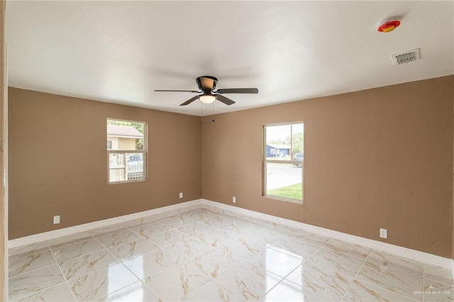 803 W Longoria St, Pharr, TX 78577 - spare room with healthy amount of natural light, a ceiling fan, and light marble finish flooring