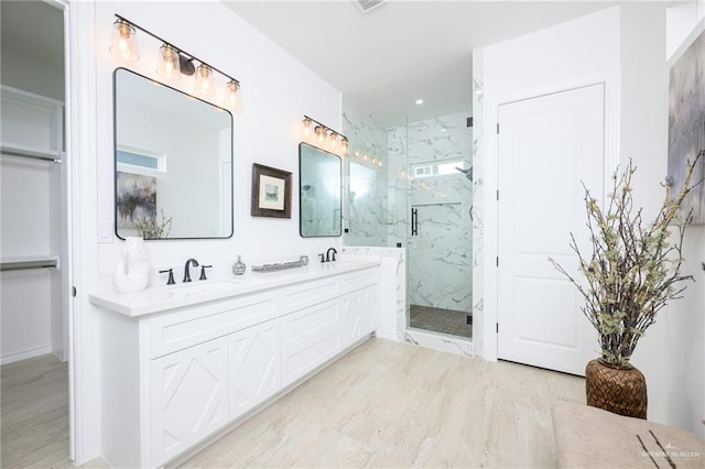 bathroom featuring hardwood / wood-style floors, vanity, and an enclosed shower