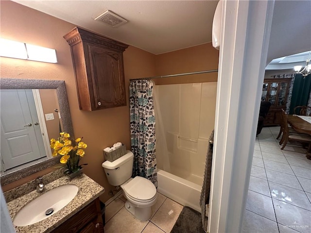 full bathroom featuring tile patterned floors, vanity, shower / tub combo, and toilet