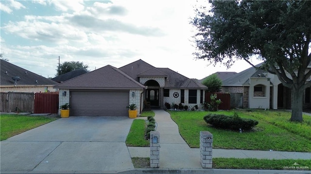 view of front facade featuring a front lawn and a garage