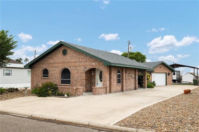 7207 Monroe St, Mission, TX 78572 - view of front of property featuring brick siding, driveway, and an attached garage