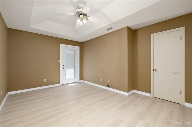 3703 N Glasscock Rd, Palmhurst, TX 78573 - spare room featuring a raised ceiling, light wood finished floors, and ceiling fan