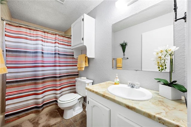 2309 W Chapin St, Edinburg, TX 78541 - bathroom featuring vanity, a textured ceiling, a textured wall, and a shower with shower curtain