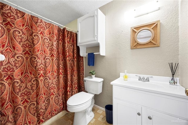 2309 W Chapin St, Edinburg, TX 78541 - bathroom with vanity, a textured ceiling, a textured wall, a shower with shower curtain, and tile patterned flooring