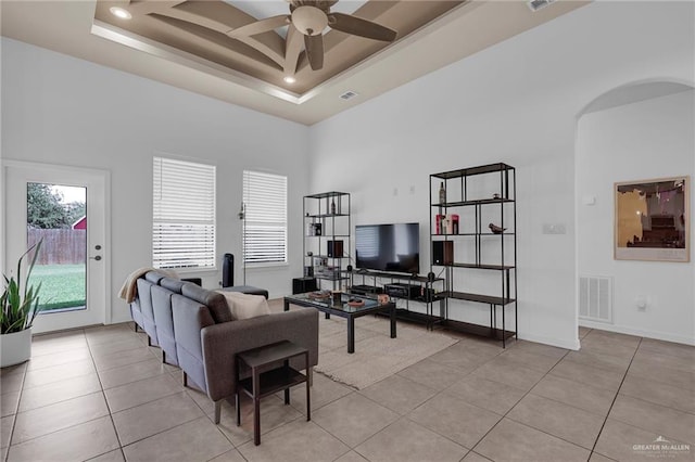 3604 Illeana St, Edinburg, TX 78539 - living area featuring light tile patterned floors, a ceiling fan, arched walkways, a raised ceiling, and recessed lighting