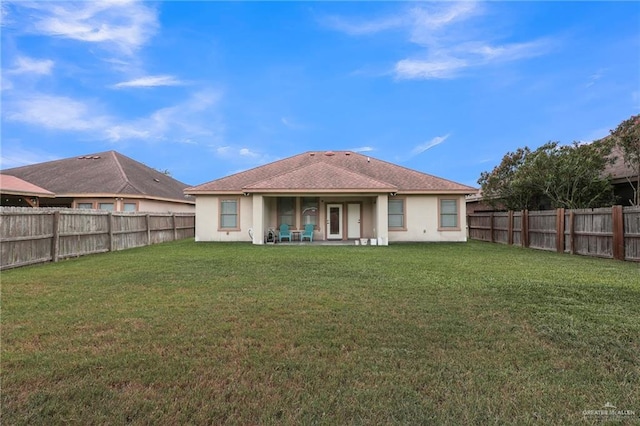 3604 Illeana St, Edinburg, TX 78539 - rear view of property featuring a fenced backyard, stucco siding, and a patio area