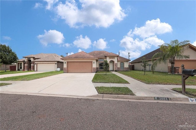 3604 Illeana St, Edinburg, TX 78539 - view of front of home with an attached garage, a front lawn, concrete driveway, and stucco siding