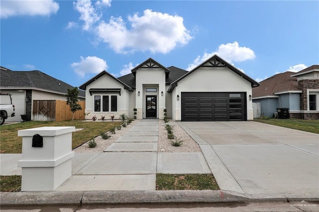1809 W Hayes Ave, Alton, TX 78573 - view of front of home featuring stucco siding, an attached garage, and driveway