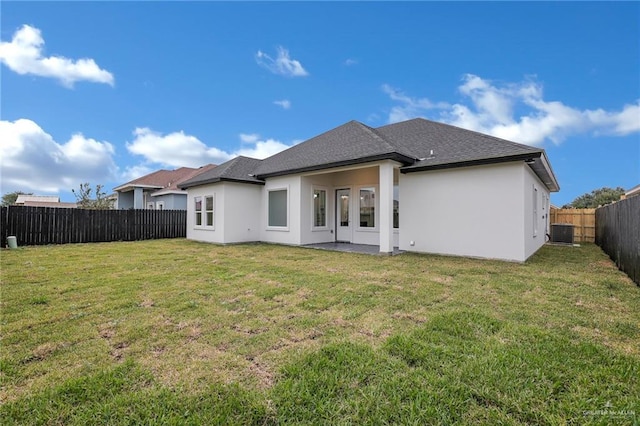 1809 W Hayes Ave, Alton, TX 78573 - back of house featuring central AC unit, stucco siding, and roof with shingles