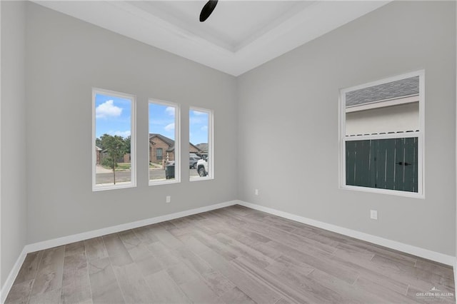 1809 W Hayes Ave, Alton, TX 78573 - empty room with wood finished floors, a ceiling fan, and baseboards