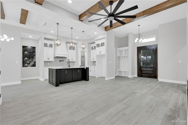 1809 W Hayes Ave, Alton, TX 78573 - kitchen featuring a sink, a ceiling fan, recessed lighting, beam ceiling, and light countertops